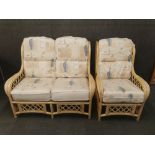 A two piece cane conservatory set, settee W. 123cm.