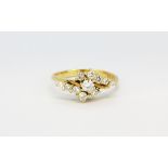 An 18ct yellow gold diamond set spray ring, (N).