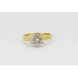 An 18ct yellow gold diamond set cluster ring, (L).