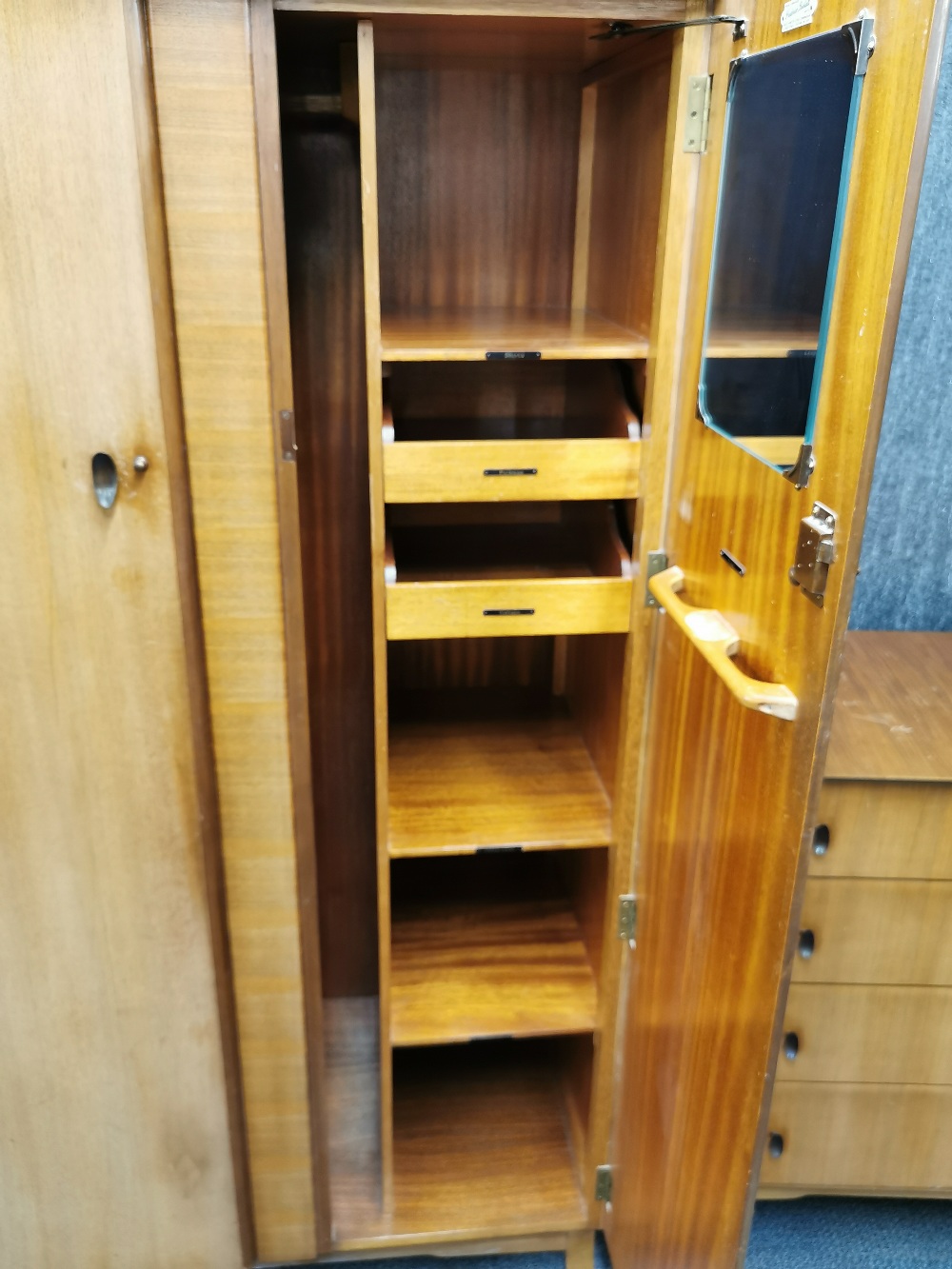 A 1960's light mahogany two door wardrobe, W. 95cm. together with a matching dressing table and - Image 4 of 5