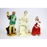 Three Royal Doulton figurines 'Christmas Morn' HN1992, 'Punch and Judy Man' HN2765, 'Musicale'