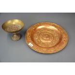 A 19th Century hammered copper tray decorated with classical scenes, Dia. 39cm. together with a