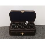 A gentleman's leather case of eight shotglasses. Case size W. 27cm.