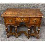 A handsome Jacobean style oak three drawer side table, 107 x 51 x 80cm.`