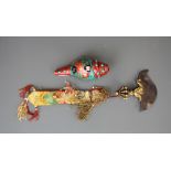 A Tibetan mosaic decorated conch shell trumpet together with a bronze and steel sacred dorje with