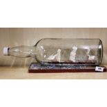 A large model ship in a bottle L. 50cm.