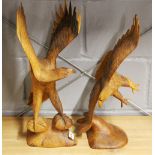Two carved wooden figures of eagles, H. 51cm.