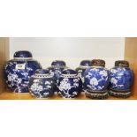 A group of Chinese hand painted porcelain jars and lids decorated with prunus pattern. Two with