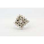 A white metal (tested 18ct gold) cluster ring set with brilliant cut diamonds, approx. 0.80ct