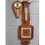 An Art Deco walnut veneered barometer, H. 80cm, together with a further barometer.