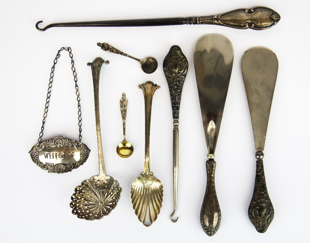 A group of hallmarked silver and silver handled items.