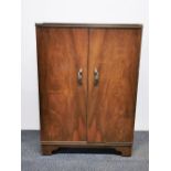 A 1950's walnut veneered record cabinet W. 51cm D. 39cm H. 86cm. Together with a mahogany bedside
