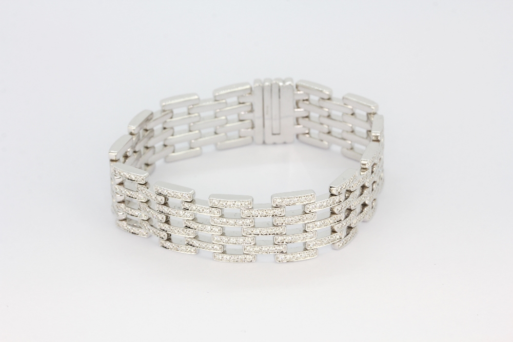 An 18ct white gold (stamped 750) bracelet set with brilliant cut diamonds, approx. 7.35ct diamonds