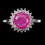 A matching 925 silver ring with a cabochon cut ruby and white stones, (M.5).