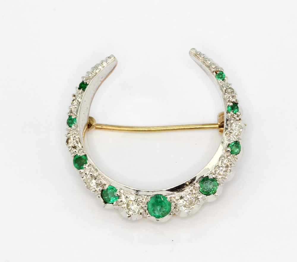 A Victorian yellow and white metal (tested high carat gold) emerald and diamond set crescent moon