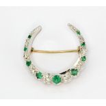 A Victorian yellow and white metal (tested high carat gold) emerald and diamond set crescent moon