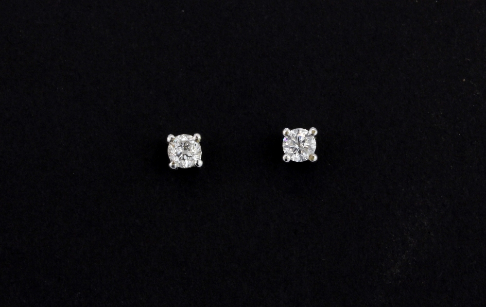 A pair of 9ct white gold (stamped 375) stud earrings set with a brilliant cut diamond, approx. 0.3ct