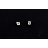 A pair of 9ct white gold (stamped 375) stud earrings set with a brilliant cut diamond, approx. 0.3ct