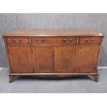 An inlaid mahogany veneered sideboard, W. 153cm H. 84cm.