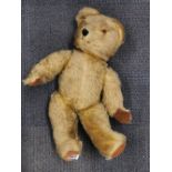 An old English articulated plush teddy bear, H. 53cm.