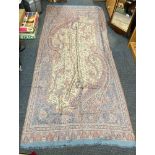 A fine Indian pale blue and beige ground Paisley silk and wool mix shawl 100 x 220cm