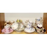 A group of 19th Century English bone china tea and coffee cups with and without saucers.