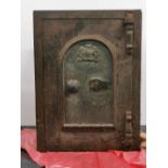 A Victorian cast iron safe with key. H. 46cm W.46cm D. 62cm