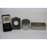 A hallmarked silver fronted dressing table clock together with a silver bookmark and two silver