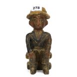 An interesting African carved and painted wooden colonial figure H. 24cm. Provenance; collection