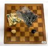 A vintage moulded plastic chess set and board, king H. 9cm.