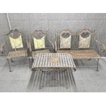 A vintage four piece continental folding wrought iron garden set, bench L. 110cm table H. 56cm.