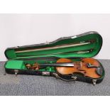 A cased Stradivarius style violin.