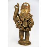 A rare African carved wood, iron and rope fetish figure with glass eyes H. 38cm. Provenance;