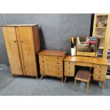 A 1960's light mahogany two door wardrobe, W. 95cm. together with a matching dressing table and
