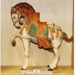 A Chinese Tang dynasty style painted terracotta horse, H. 48cm.