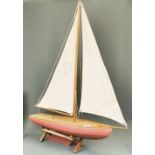 A large wooden model pond yacht, L. 70cm, H. 94cm.