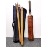 A vintage genuine willow cricket bat and stumps.