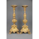 A pair of early 18th century Italian gilt wood candlesticks, H. 51cm.