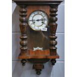 A 19th century striking mahogany wall clock, H. 55cm.