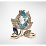 A 925 silver tulip shaped ring set with pear cut blue topaz and sapphire, (P).