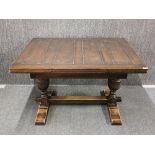 A refectory style oak draw leaf dining table, extended L. 183cm W. 83cm H. 74 cm.