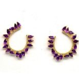 A pair 925 silver gilt earrings set with pear cut amethysts and white stones, L. 3cm.