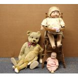 An Armand Marseille porcelain head child doll with high chair, a AM doll and two articulated teddy