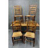A 1920's oak refectory table with four ladder back rush seated chairs, L. 150 x 75cm.