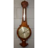 An early 19th Century walnut veneered barometer H. 98cm.