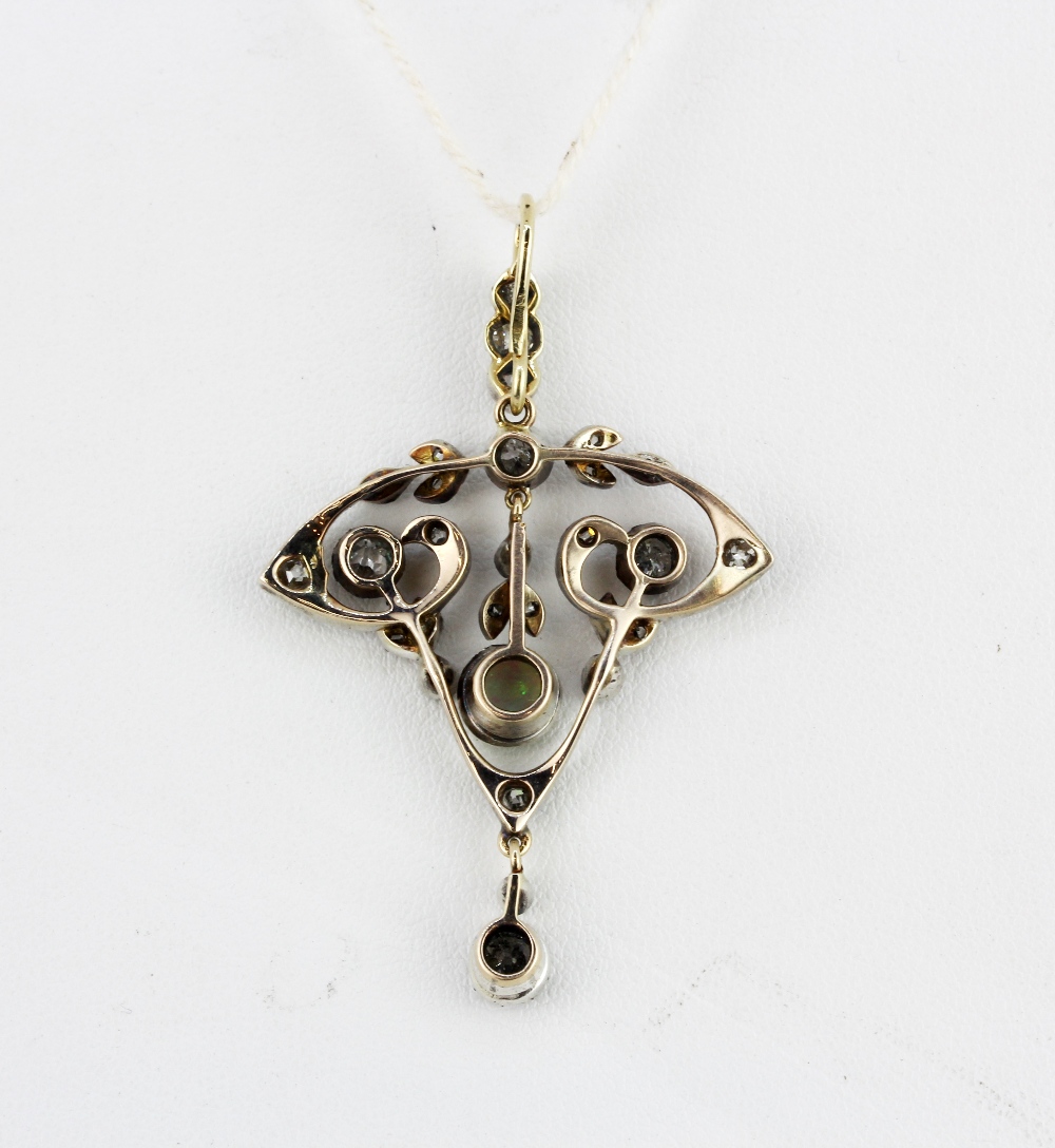 An Edwardian yellow and white metal (tested gold) pendant set with a cabochon cut opal and old and - Bild 2 aus 2