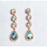 A pair of 925 silver rose gold gilt drop earrings set with blue topaz and white stones, L. 4.2cm.