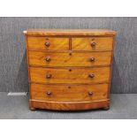 A Victorian polished pine five drawer bow front chest, H. 105cm, W. 109cm.