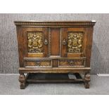 A carved mid 20th century continental oak cabinet, W. 91cm H. 85cm.