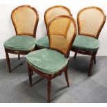 A set of four Simon Horn hardwood and cane dining chairs, purchased c. 1969.
